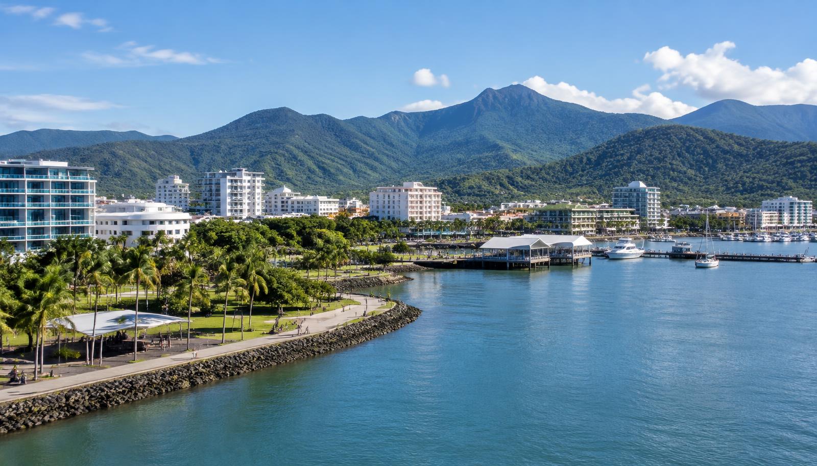 Cairns waterfront and tropical mountain backdrop — illustrative city image