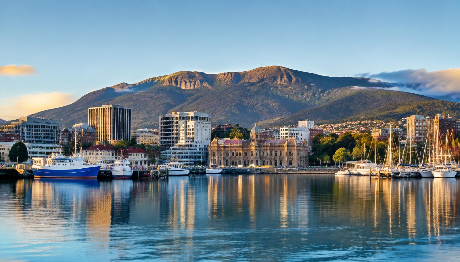 Hobart waterfront beneath kunanyi/Mount Wellington — illustrative city image